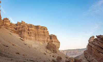 Fototapeta premium Red sandstone cliffs in Charyn Canyon's Valley of Castles, Kazakhstan