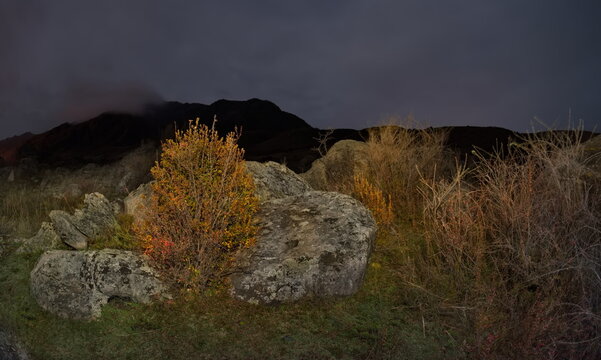 Russia. The South of Western Siberia, the Altai Mountains. Autumn moonlit night in the stone valley of the mountain river Katun near the village of Inia.