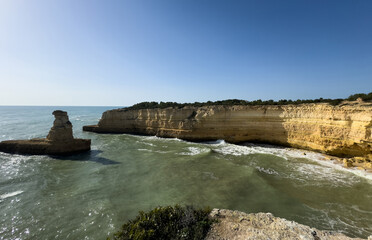 Morena beach, Algarve, Portugal, rock formation cliff in southern Portugal at sunrise