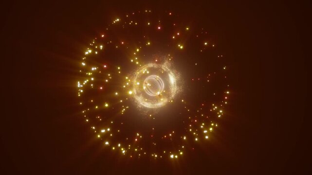 Golden sparkling particle ring with glowing center on warm dark background