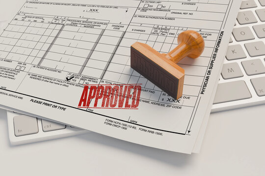 Wooden stamp with approved text on health insurance application form