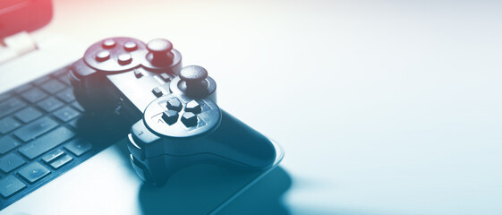 Gamepad and computer keyboard on white background. Focus on joystick.