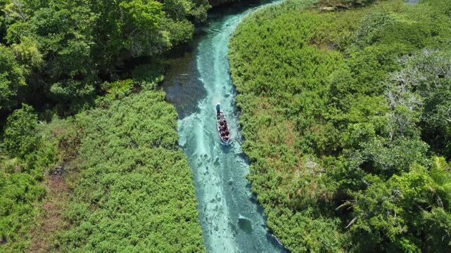 Aerial drone view of tourists on a boat tour in the crystalline Sucuri River in Bonito, Mato Grosso do Sul, Brazil