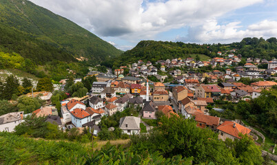 Fototapeta premium Travnik town architecture with surrounding mountains and urban landscape, Bosnia and Herzegovina.