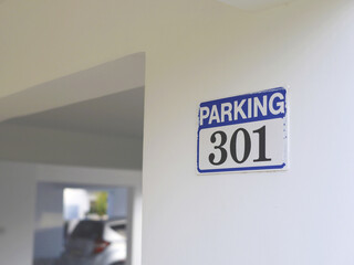Blue Parking Sign On Interior Wall