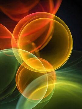 Multicolored translucent spheres with overlapping glowing effects creating a dynamic luminous pattern on a dark background in vibrant orange, yellow, and green hues