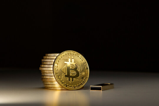 Bitcoin stack and USB drive crypto wallet. digital currency storage