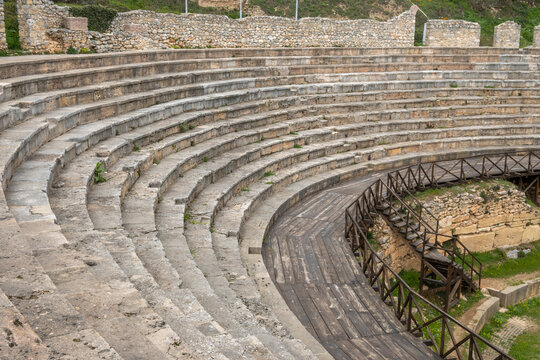 Detailed perspective of worn stone steps and wooden walkways within the Ancient Macedonian Theatre of Lychnidos, showcasing historical textures and design in Ohrid, North Macedonia