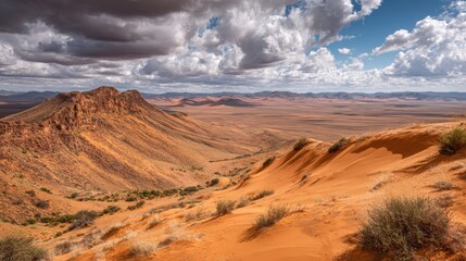 Naklejka premium Breathtaking Desert Landscape with Dramatic Clouds and Dune Formation in a Remote Location Under Open Sky