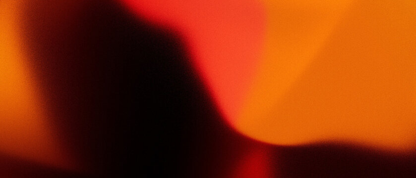 Grainy abstract red orange brassy brown gradient background with noise texture for wide banner and header