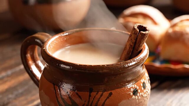 Steaming hot chocolate in traditional clay mug with cinnamon 4K Video