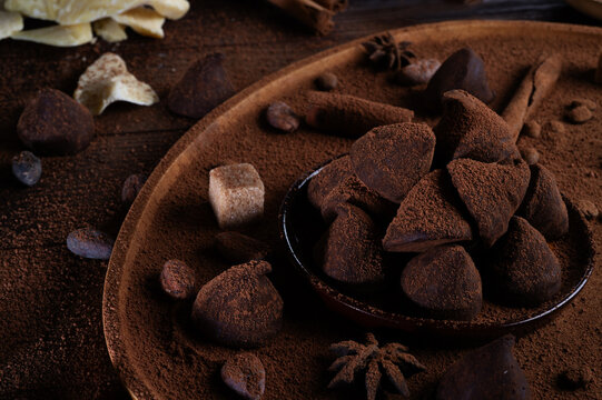 healthy delicious chocolate truffles around ingridients with natural cocoa beans,  powder, cacoa butter, cane sugar. healthy sweets concept