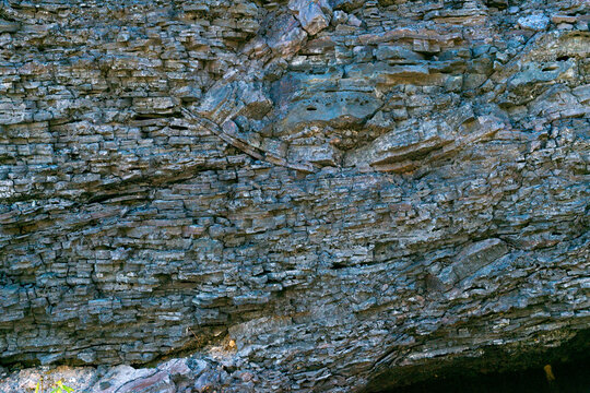 Canada, BC, Anaconda (near Greenwood), BC.   Glasslike remains of old slag pile, outside abandoned British Columbia Copper Company smelter.  It processed ore from the nearby Motherlode Mine 