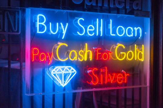 USA, Hawaii, Honolulu.  Neon sign in the window of pawn shop in Honolulu