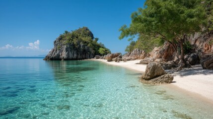Obraz premium Serene Tropical Beach with Clear Water and Rocky Formation Under Bright Blue Sky Near Lush Green Island Landscape in Summer Sunshine