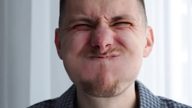 Big cheeks.
Puffy cheeks.
A person pouting with anger.
A mouth full of air.