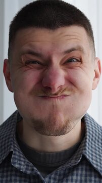 puffed-out cheeks on his face.
The man holds his breath for a long time.
A mouthful of air