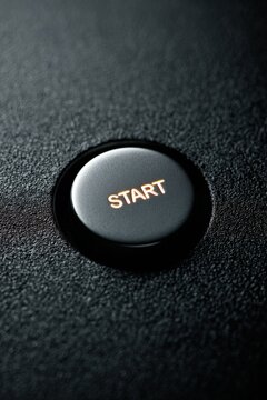 Close-Up of Illuminated Start Button with Crisp Texture and Focused Lighting