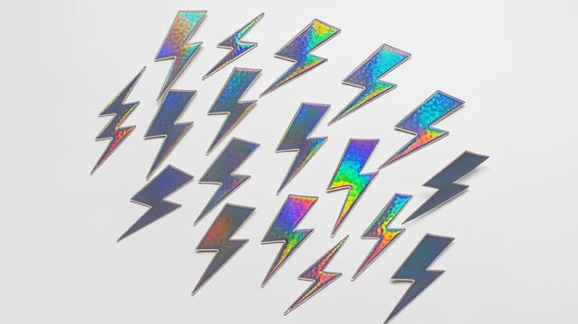colorful holographic lightning bolt stickers arranged on white surface in creative pattern