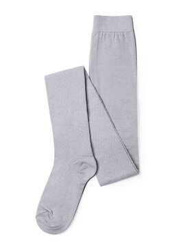 New folded gray children's tights, isolated on a white background, top view. Genuine photo, not generated by AI