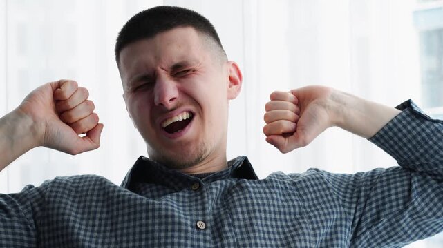 Sleepiness.
A person yawns due to lack of sleep and fatigue.