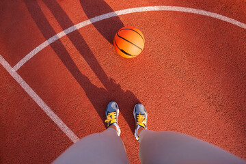 Active woman standing on a basketball court