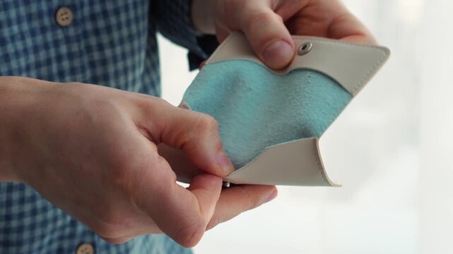 Financial crisis and lack of money.
An empty wallet.
A man has lost all his money.