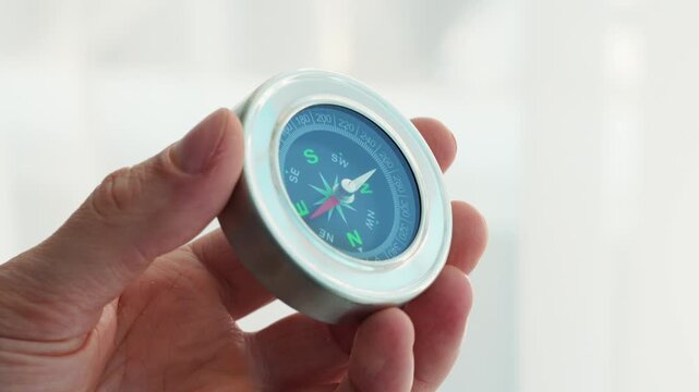 Magnetic compass in hand.
Navigation method.
Navigating a route using a compass