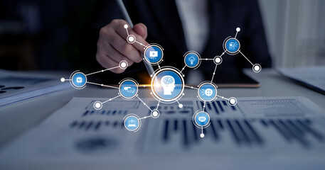 A businessman engages with advanced technology, incorporating artificial intelligence elements and...