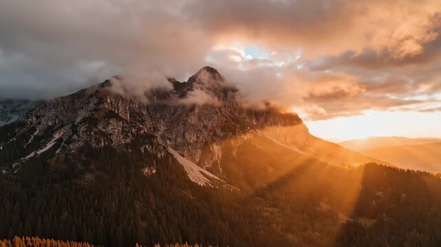Aerial Flight Over Misty Mountain Landscape with Coniferous Forest at Sunrise