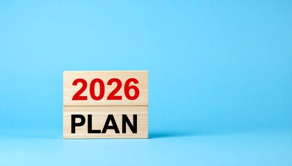   
Wooden Blocks Showing 2026 Plan Text on Light Blue Background