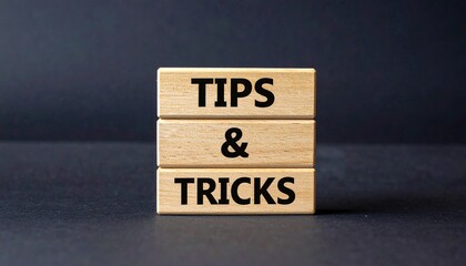Wooden Blocks Stacked with Tips and Tricks Text on Dark Background