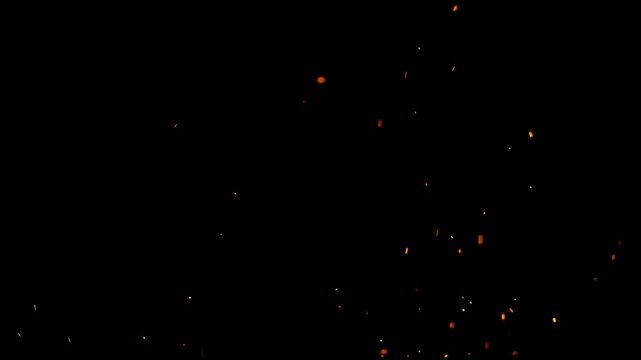Enchanting sparks floating upwards in a dark space, evoking a sense of magic and wonder. Perfect for adding a touch of dynamism and visual interest to your project.
