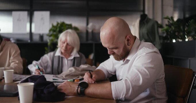 Artists engage in brainstorming and sketching together in a vibrant workspace filled with inspiration and creativity