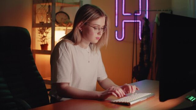 Close up of tired woman working at night on laptop. Girl in eye glasses with reflections overworking busy. Using computer in dark office. Closeup of Young Adult Women Wearing Reflective Eye Glasses