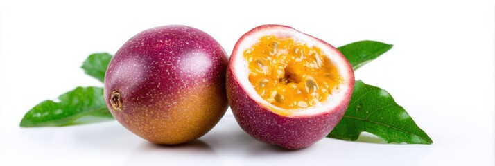 Ripe passion fruit with halved interior and green leaves on white background