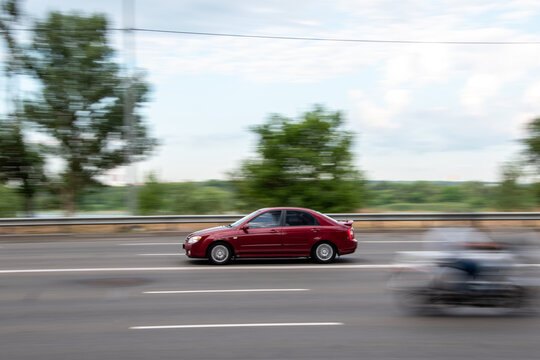 Ukraine, Kyiv - 29 July 2021: Red Kia Spectra car moving on the street. Editorial