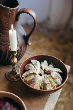 Ukrainian pickled herring with potatoes by candlelight