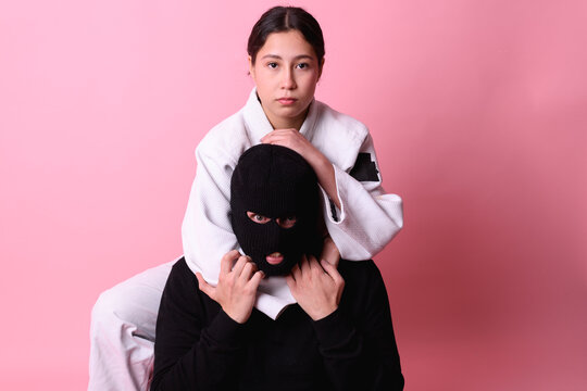 Focused Martial Artist Applying a Rear Naked Choke Technique