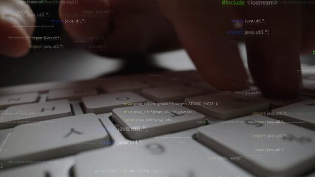 A focused close-up image showcasing hands actively typing on a sleek computer keyboard. Surrounding text resembles code, emphasizing programming and technology themes. Xenic