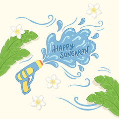 Water gun shooting Happy Songkran with palm leaves and frangipani flowers