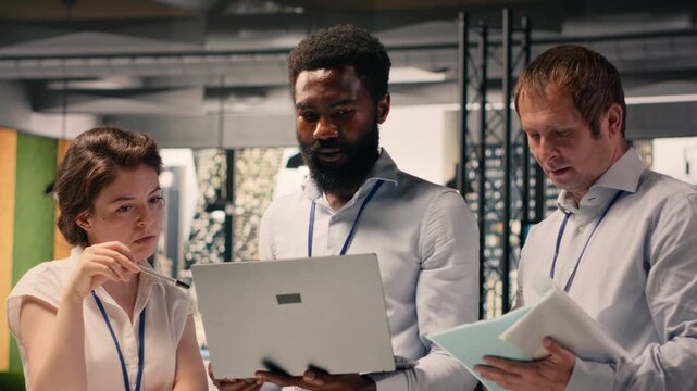 Business team, strategy and action plan, formal briefing meeting. Visual data, reports and metrics, professionals analyzing performance, compliance and risk assessment, corporate environment.