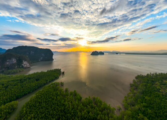 Aerial view sunset sky,Nature beautiful Light Sunset or sunrise over sea,Colorful scenery sunset Panorama Sky with Amazing clouds and waves in the ocean golden light cloud background