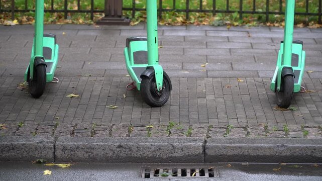 Scutters parked on the sidewalk in central Riga, Latvia.