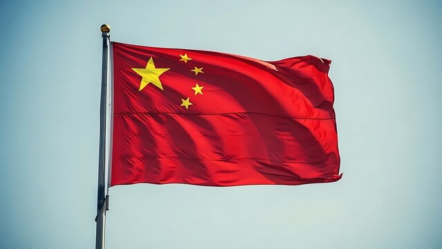 The chinese flag waving in the wind outdoors