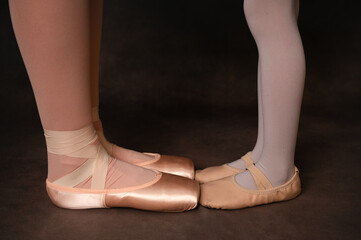 Older and younger dancers feet © Holly