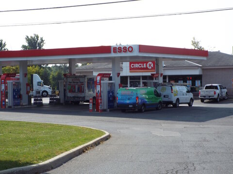 Nepean, ON, Canada-July 14,2025: An "Esso gas station and Circle K" convenience store on W Hunt Club Rd.