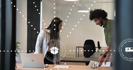 Collaborating pair in work attire leaning at office meeting table, with laptop and glass partition © vectorfusionart