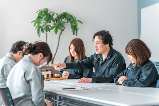 A businessman in work clothes getting angry at the other party during a meeting, a conference, or a business negotiation (furious, scolding, preaching)