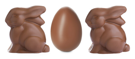 Fototapeta premium Chocolate bunnies and egg isolated on white. Easter celebration